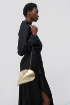 HANDBAGS BRIDGET METAL OYSTER SHELL CLUTCH IN GOLD Simkhai